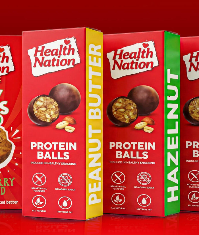 Health Nation protein ball boxes on a red background. Private label by Flour Girl UAE Dubai Abu Dhabi.